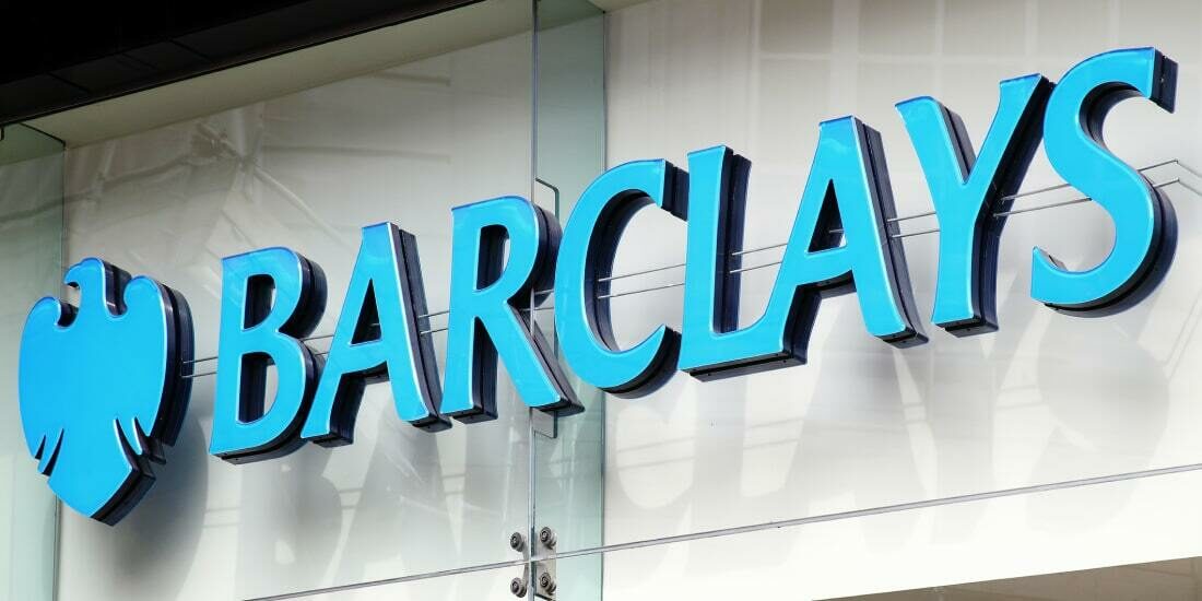 A Barclays Bank sign over a glass facade
