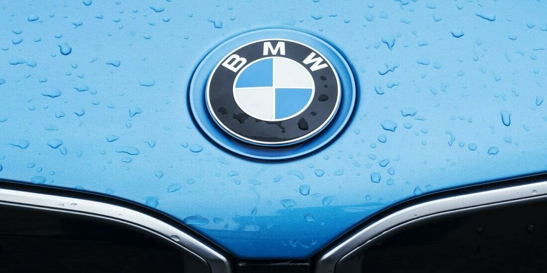 BMW logo on the bonnet of a blue car